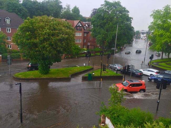 Water has flooded roads in south London for the second time in the space of a week 