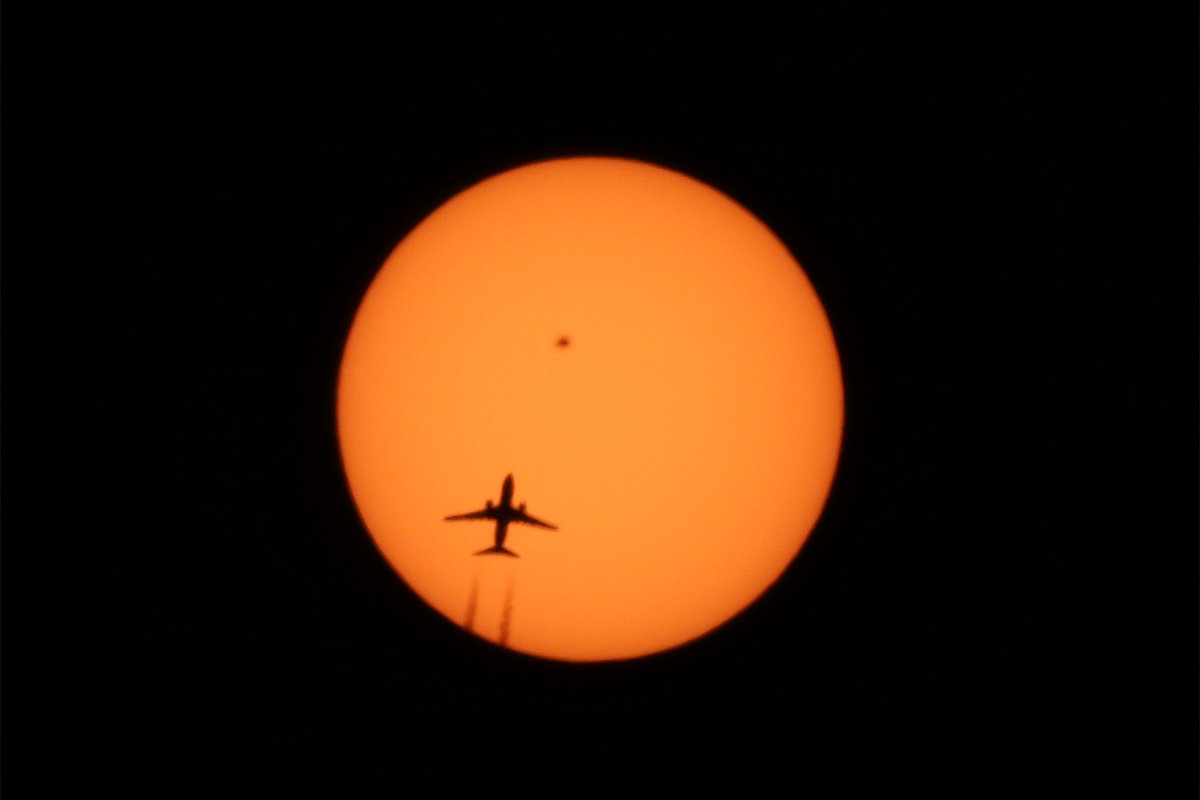 Click to enlarge Plane sillouette sunspot