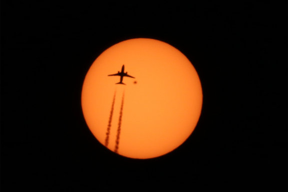 Click to enlarge Plane sillhouette sunspot