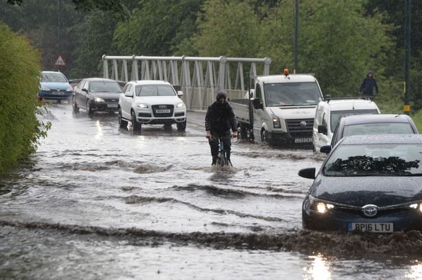 Pictured flooding due to heavy rain and thunderstorms on Yardley Green Road, Yardley.