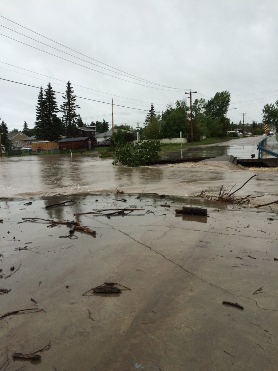 Flood on Dawson Creek has DESTROYED the 15th street bridge