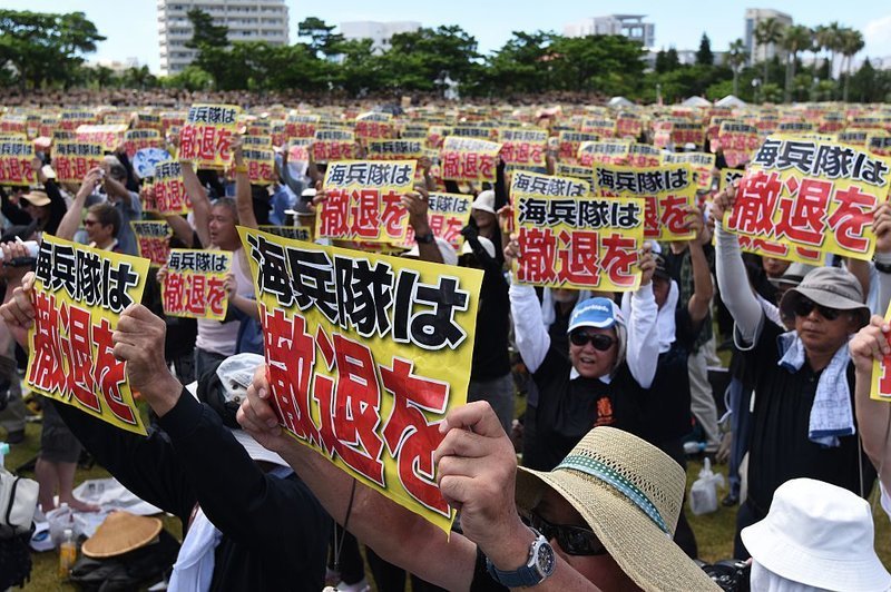 Click to enlarge protester signs okinawa japan