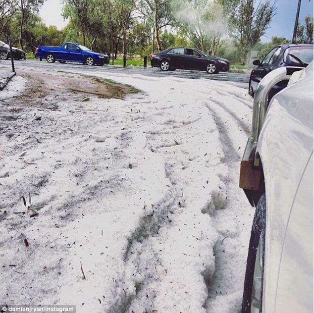 Ice stayed on the road in thick layers, mixed with dirt and leaves in the Northern Territory town