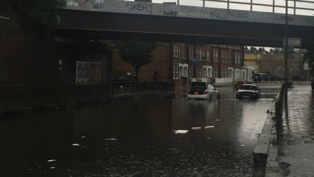 Cars were left stuck in floodwater in Battersea, south London