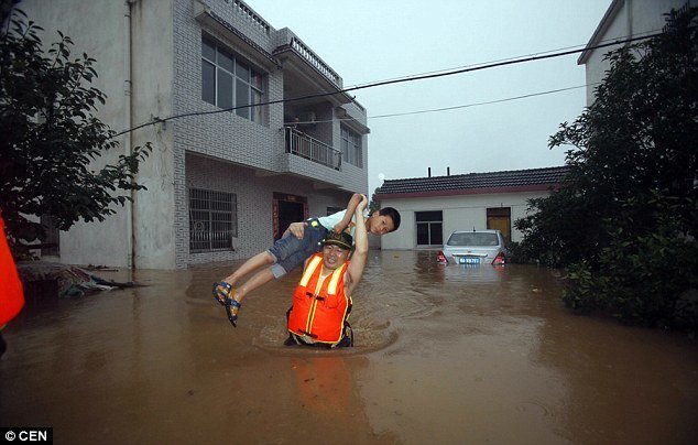 Helping those in need: Rescue teams have been working to evacuate those affected in the region