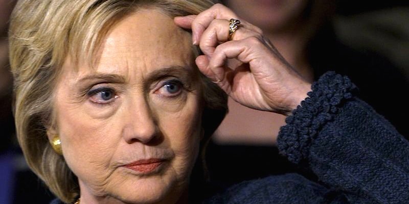 Hillary head scratching