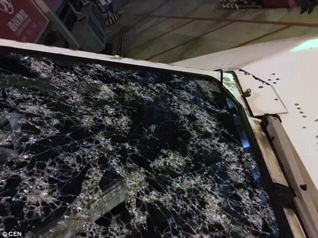Click to enlarge A close up shot of the windshield shows the extent of the damage, where the glass was completely cracked but managed to hold its shape