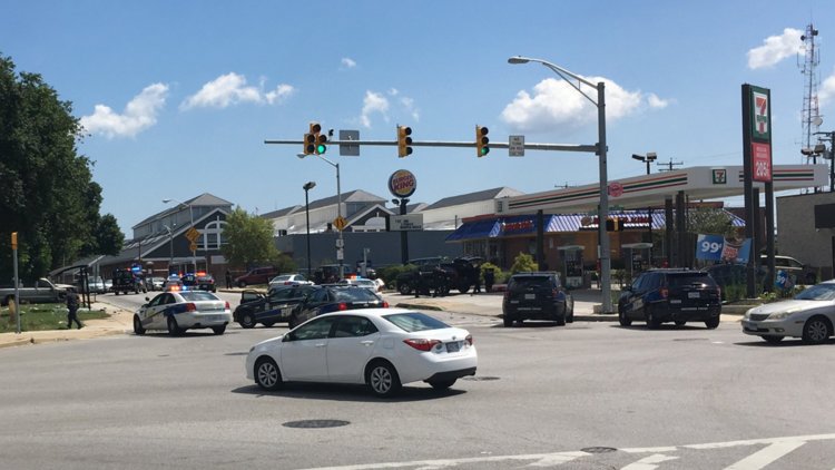 cop cars baltimore intersection hostage situation burger king