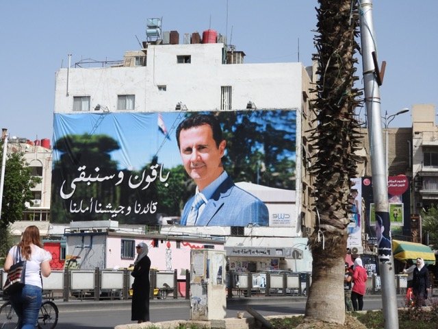 assad billboard damascus