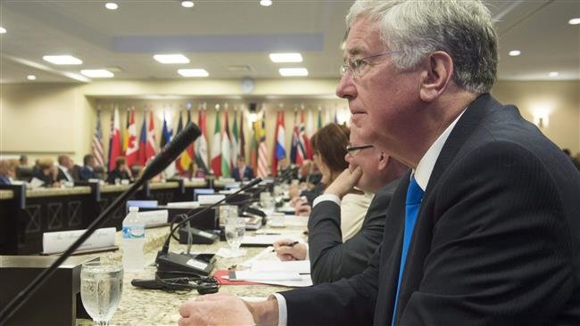 Click to enlarge British Defense Secretary Michael Fallon
