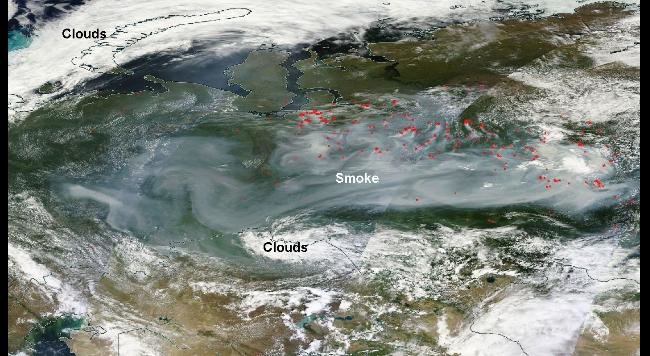 Smoke across Russia on satellite July 20, 2016. Each red dot shows fire/thermal anomalies detected by satellite. 