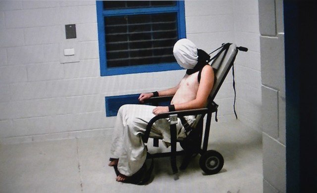 Click to enlarge Teen boy hooded and strapped