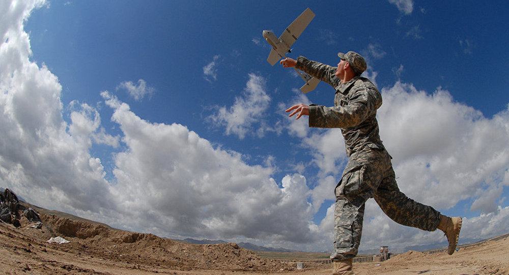 Click to enlarge Soldier launching drone