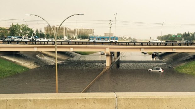 A car is stranded in a flooded part of the Whitemud on Wednesday afternoon. 