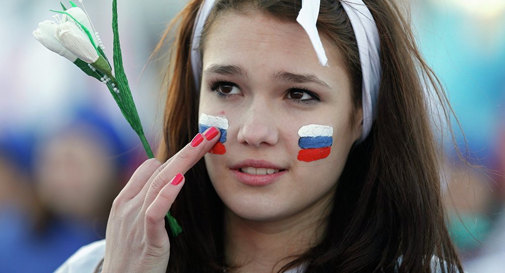 Young girl with Russian flag face paint