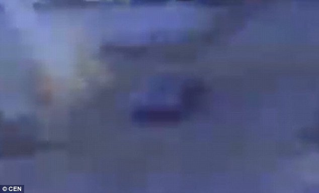 Traffic cameras captured a large white flash before the man, identified only by his surname Han, is seen falling backwards