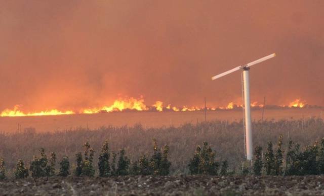 Click to enlarge A fire burning on the Yakima Training Center near Moxee