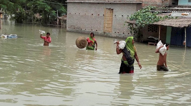Gopalganj: Villagers move to a safe place from floods in Gopalganj in Bihar on Saturday. 