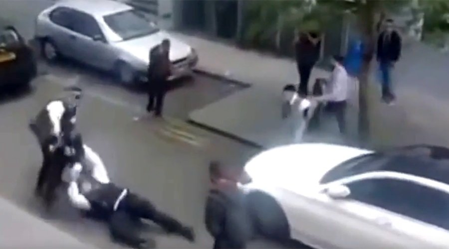 Metropolitan Police officers scuffle