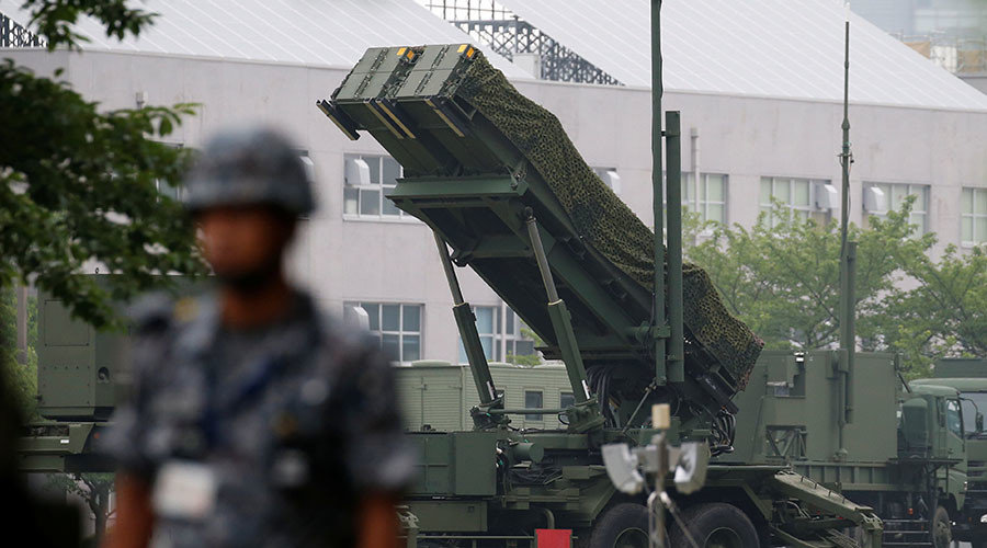 Click to enlarge Japan Self-Defense Forces soldier guards near a unit of Patriot Advanced Capability-3 (PAC-3) missiles at the Defense Ministry