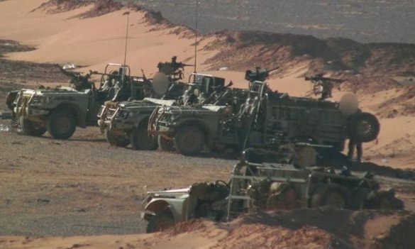 Click to enlarge British special forces patrolling near a rebel army base close to the Syria-Iraq border