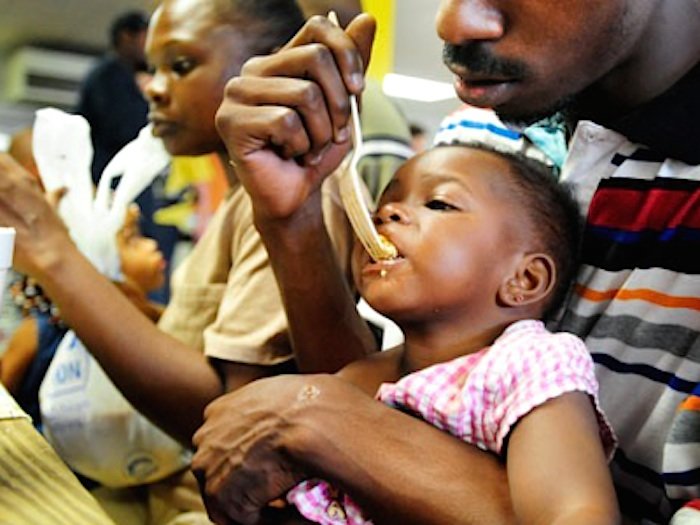 Click to enlarge Black family feed child