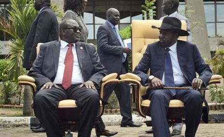Click to enlarge First Vice President Riek Machar, left, looks across at President Salva Kiir,