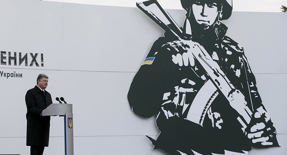 Poroshenko speaking in front of soldier painting