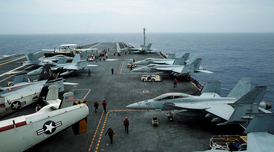 F/A-18 Hornet fighter jets and E-2D Hawkeye plane are seen on the U.S. aircraft carrier John C. Stennis