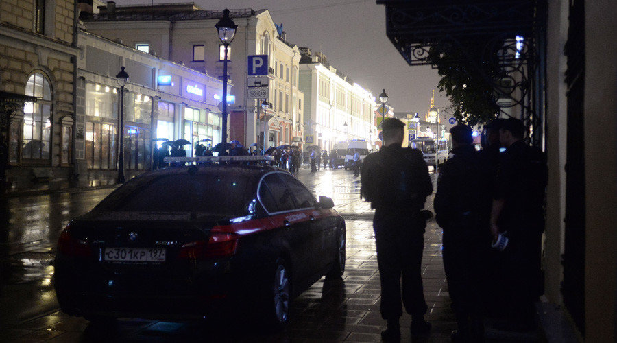 Police officers cordon off the territory near a Citibank office on Bolshaya Nikitskaya Street in central Moscow, where a man took hostages and threatens to blow up the building.