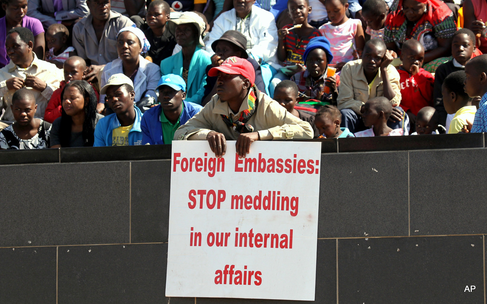 Click to enlarge A supporters of Robert Mugabe