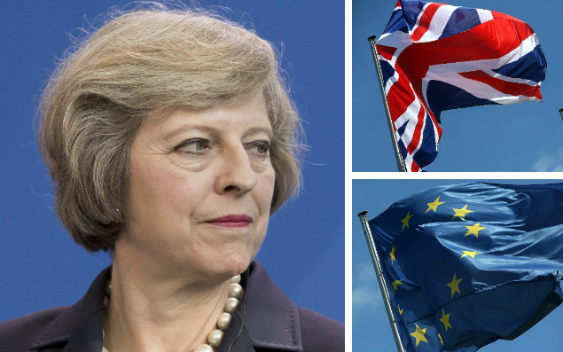 Theresa May and UK and EU flags