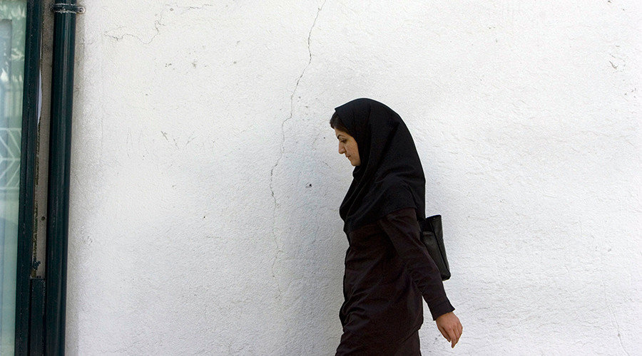 Muslim woman walking alone