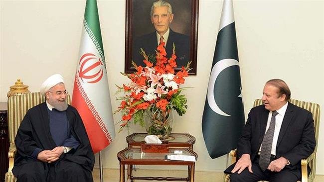 Pakistan's Prime Minister Nawaz Sharif (R) meets Iranian President Hassan Rouhani