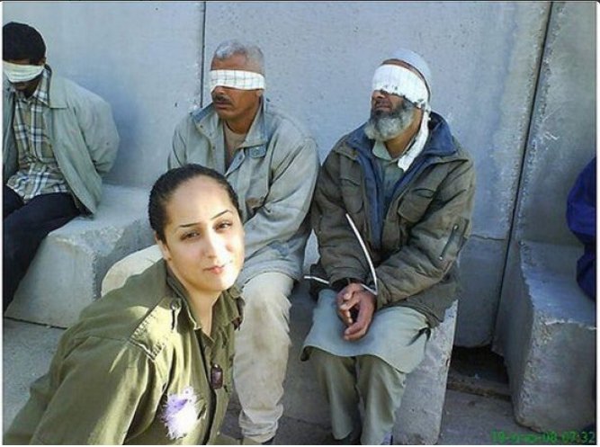 Eden Abergil posted this picture of herself with blindfolded Palestinian prisoners on Facebook in 2010