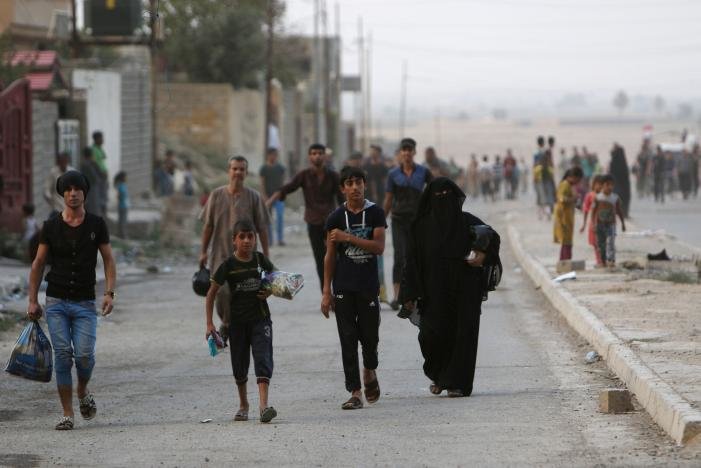 Click to enlarge Iraqi walk in the city of Qayyara, Iraq