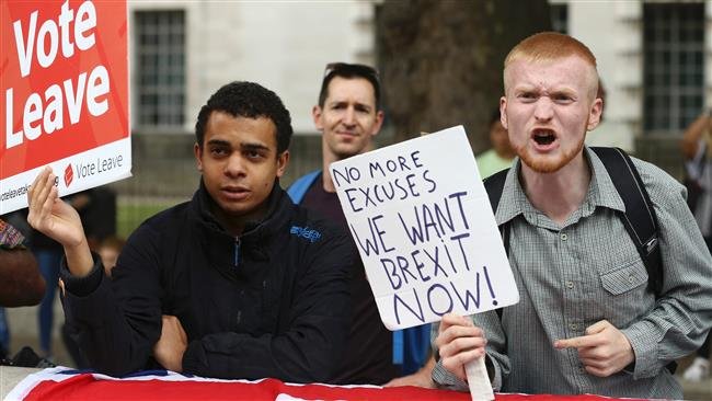 A man shouts in a counter protest against demonstrators who protest the Brexit vote in a rally in central London