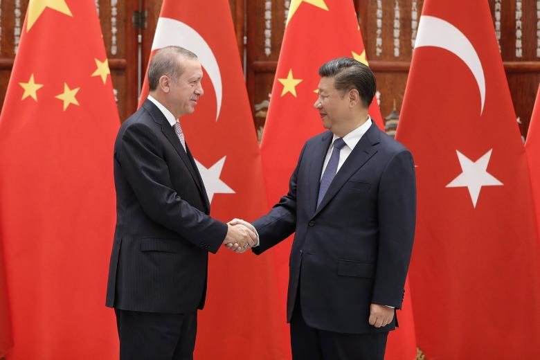 Chinese President Xi Jinping (right) shakes hands with Turkish President Recep Tayyip Erdogan