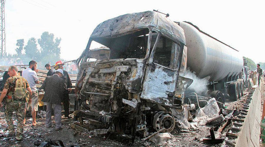 Click to enlarge Syrian army soldiers inspect the damage at the site of two explosions