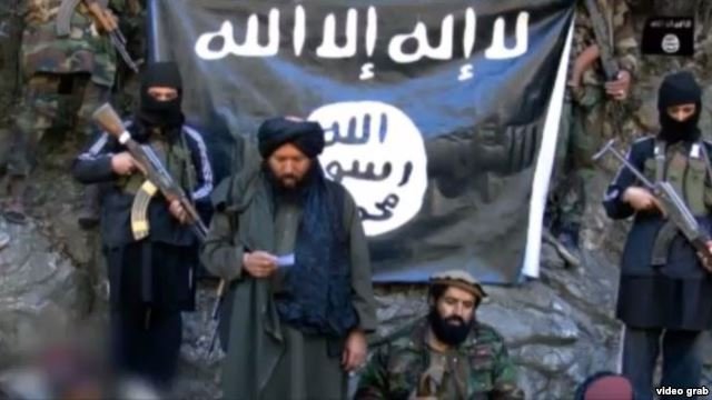 Click to enlarge IMU leader Usmon Ghazi (second left) pledges loyalty to ISIS