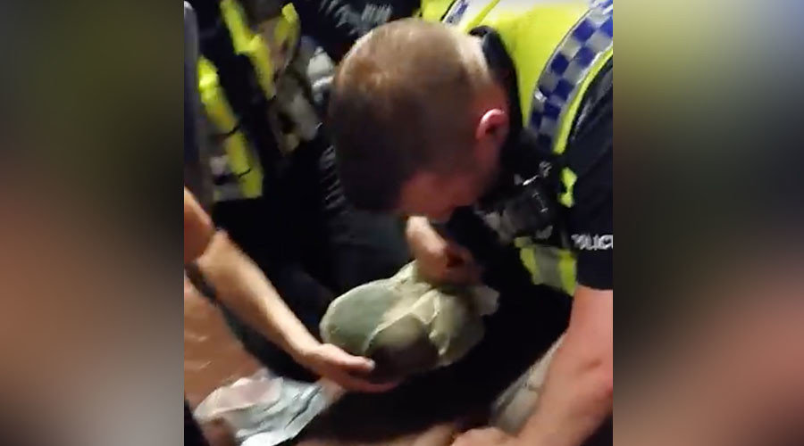Click to enlarge Police bagging suspect