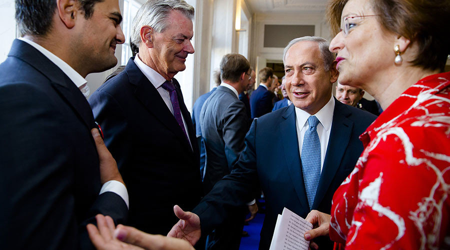 Click to enlarge Dutch Parliament Member Tunahan Kuzu (L) refuses to shake hands with Prime Minister Benjamin Netanyahu