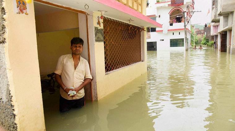  A man awaits relief material in flood-hit Pant Nagar area of Gaya on Wednesday.