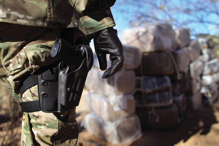 Click to enlarge DEA with gun