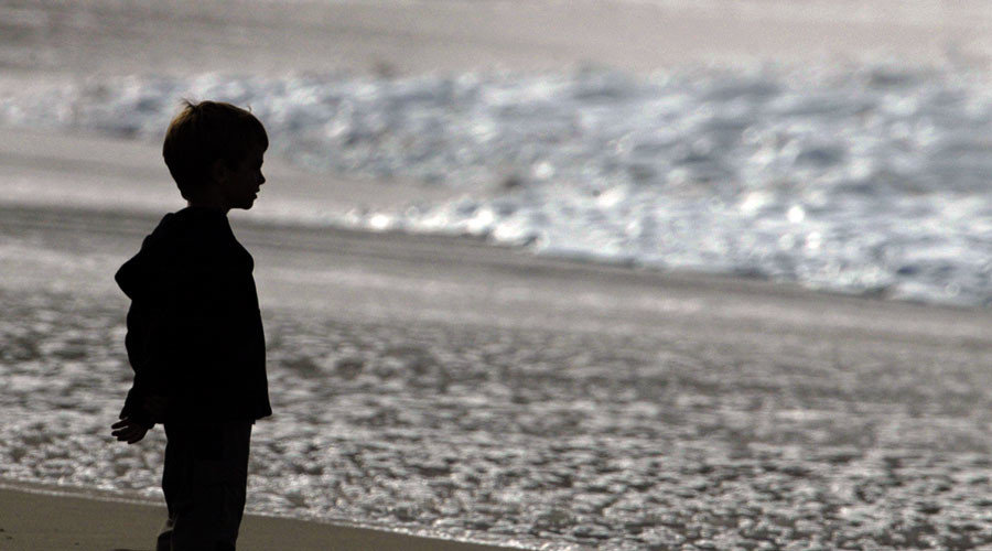 Click to enlarge child sex assault victims, child on beach