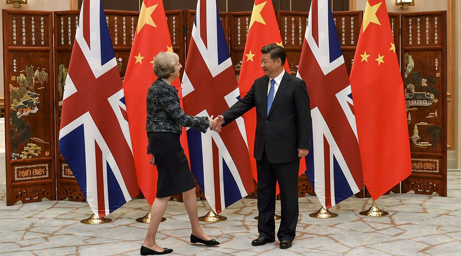 Chinese President Xi Jinping shakes hand with British Prime Minister Theresa May