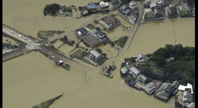 This aerial photo shows a submerged area in Nobeoka, Miyazaki prefecture, southern Japan Tuesday, Sept. 20, 2016. A powerful typhoon brought heavy rainfall in southern Japan.  
