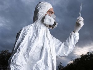 Hazmat doctor checks sample