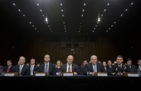 Director of National Intelligence James Clapper, center, and other security agency officials testify on Capitol Hill on Jan. 29