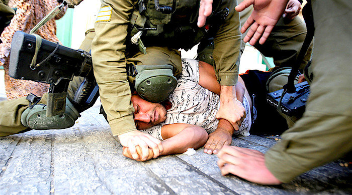 Palestinian under foot IDF